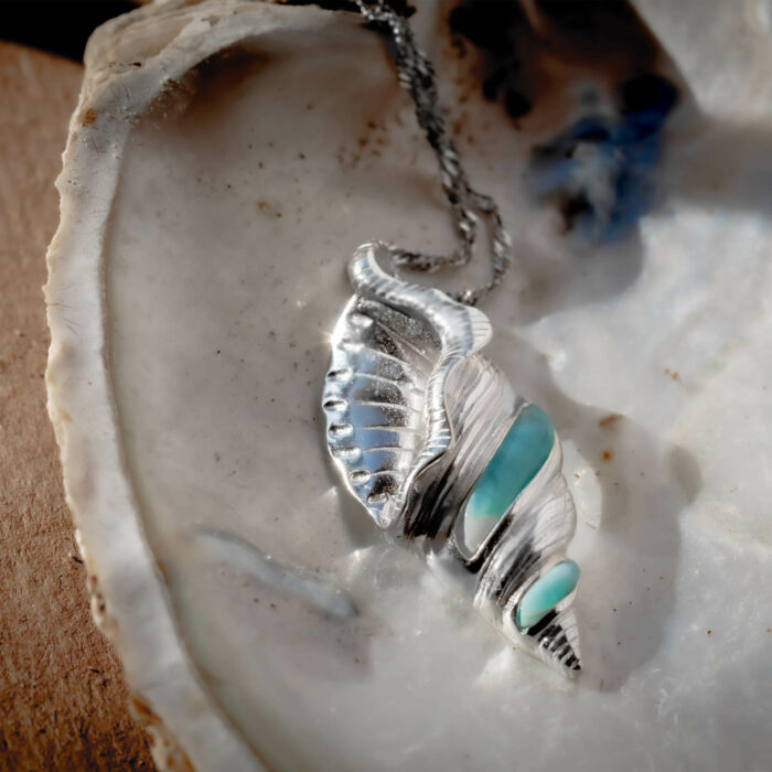 Shop for conservation by purchasing this 925 sterling Silver and larimar necklace that resembles a dove shell from the Collumbellidae family that helps protect what you love