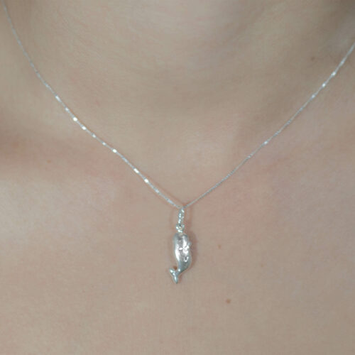 Shop for conservation by purchasing this 925 sterling Silver necklace that resembles a baby humpback whale to help protect what you love, coral reefs and ocean ecosystems