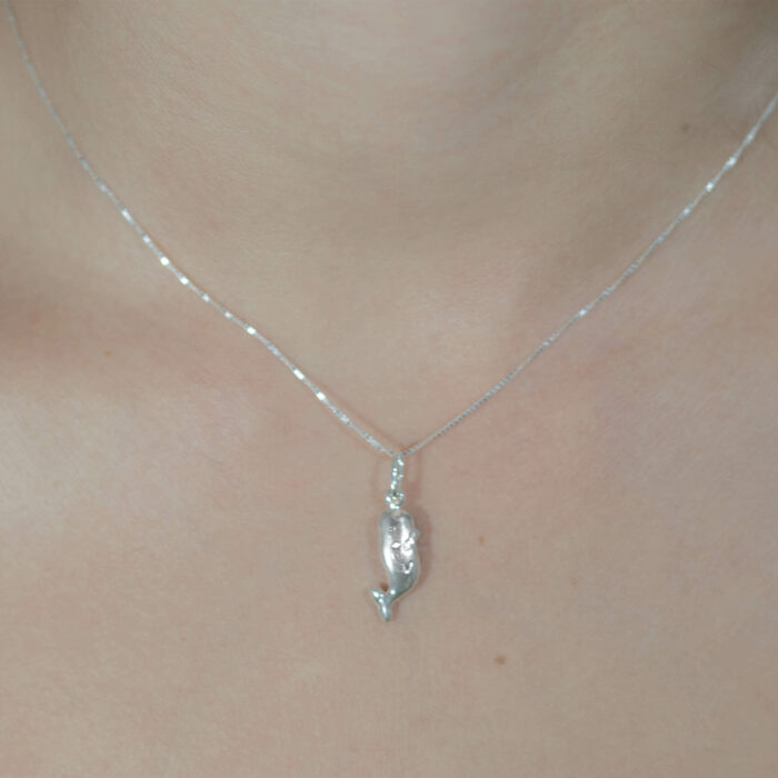 Shop for conservation by purchasing this 925 sterling Silver necklace that resembles a baby humpback whale to help protect what you love, coral reefs and ocean ecosystems