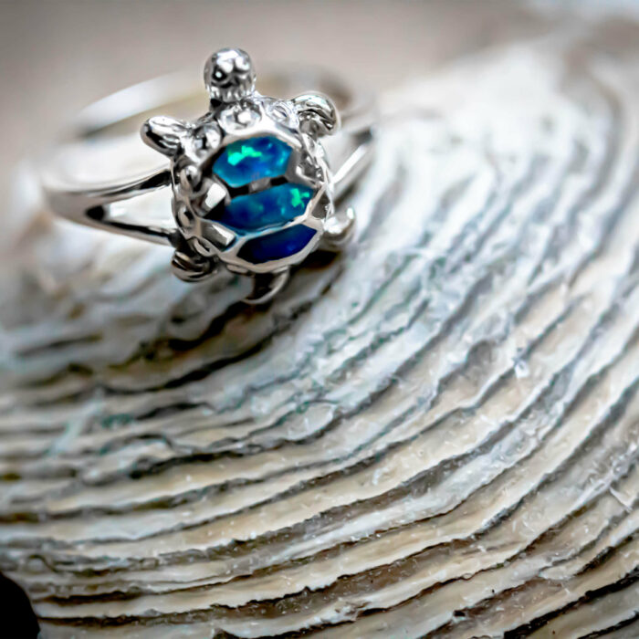 This ring is made of 925 Sterling Silver and Opal. The Mystical Turtle ring represents our uncommon aggregation of foraging Green Turtles in Matapalito Bay in Costa Rica.