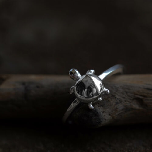 This ring is made of 925 Sterling Silver and resembles a tiny turtle hatchling on its first journey to the ocean.