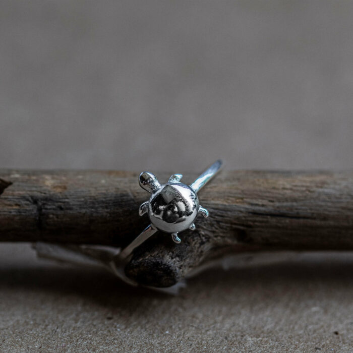 Shop for conservation by purchasing these 925 sterling silver ring that resembles a hatchling sea turtle to help protect ocean ecosystems and fight climate change in costa rica