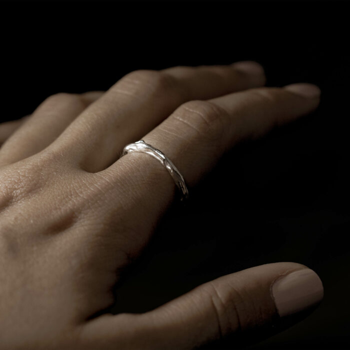different ideas of how to wear simple band rings shaped like coral reef skeletons due to bleaching events