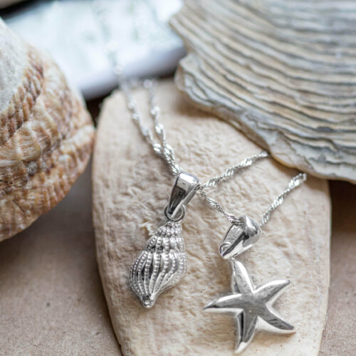 Conch, shell and sea star or starfish pendants and necklaces made of 925 sterling Silver for beach and ocean lovers, undersea explorers and marine conservation activists who wish to support wildlife conservation and community empowerment in costa rica by shopping for jewelry pieces